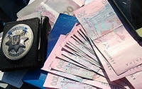 Киевские полицейские погорели на взятке в 20 тыс. гривен