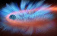 B NASA показали, как чёрная дыра уничтожает звезду (ВИДЕО)